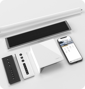 Smart home automation system with a control hub, remote controls, wall panel, sensor bar, cylindrical device, and a smartphone displaying an app interface, all on a white surface.