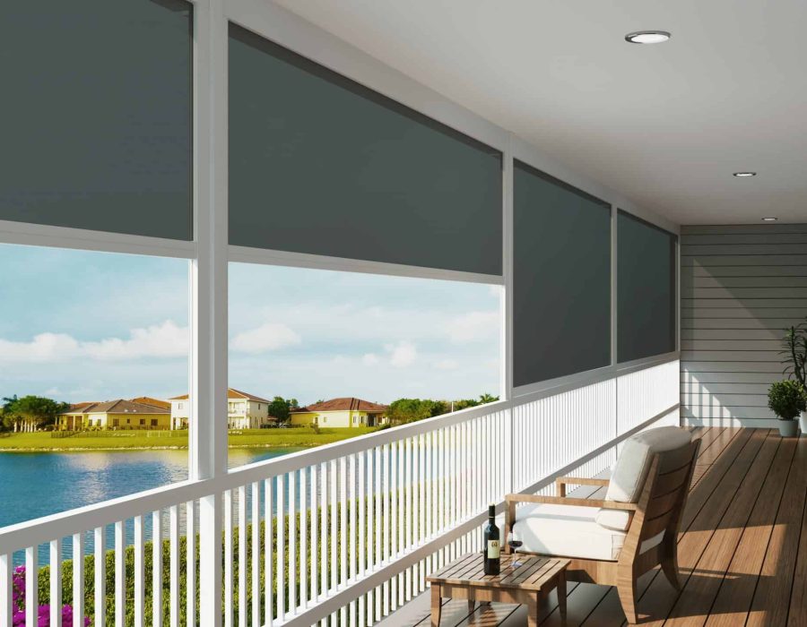 Sunlit balcony with bench, side table, and lake view.